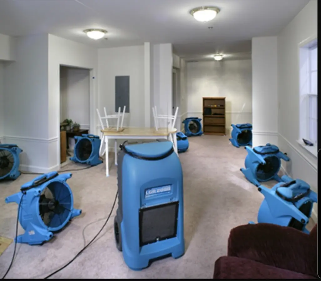 Air movers and dehumidifier setup for Water Damage Restoration in Woodward