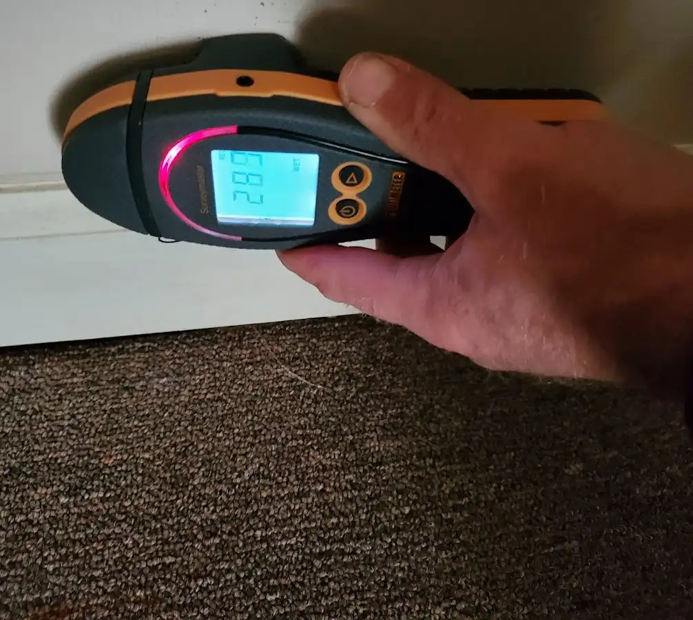 Moisture detection at baseboard during Burst Pipe Cleanup in Woodward